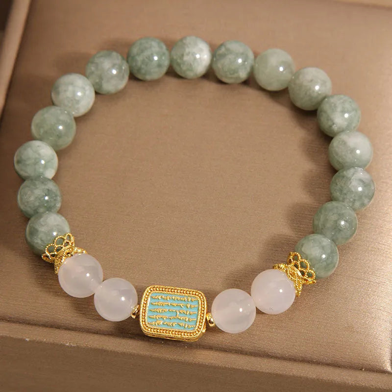 Oil green emerald crystal bracelet with five faceted beads on a string for women.