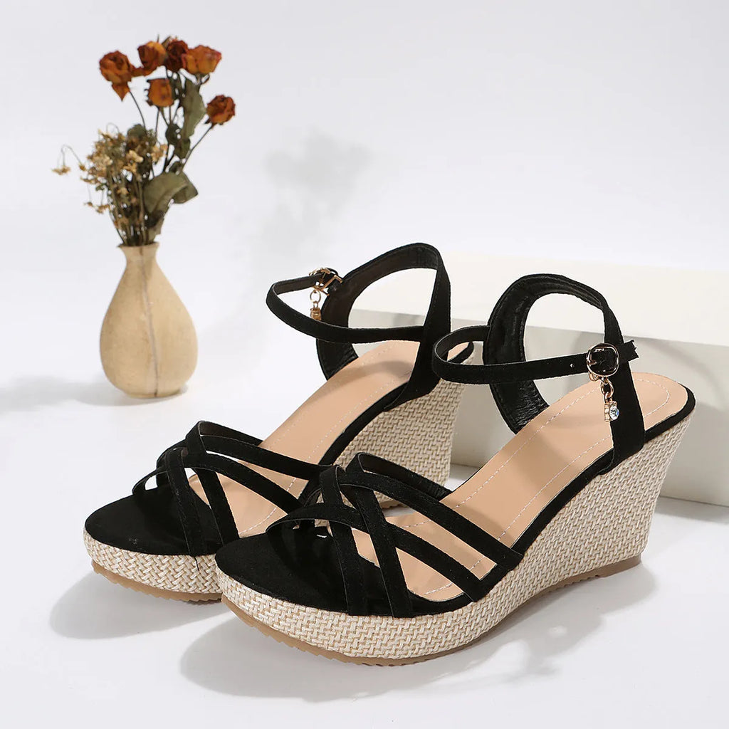 Women's black wedge sandals with a fish mouth open toe and cloth upper.