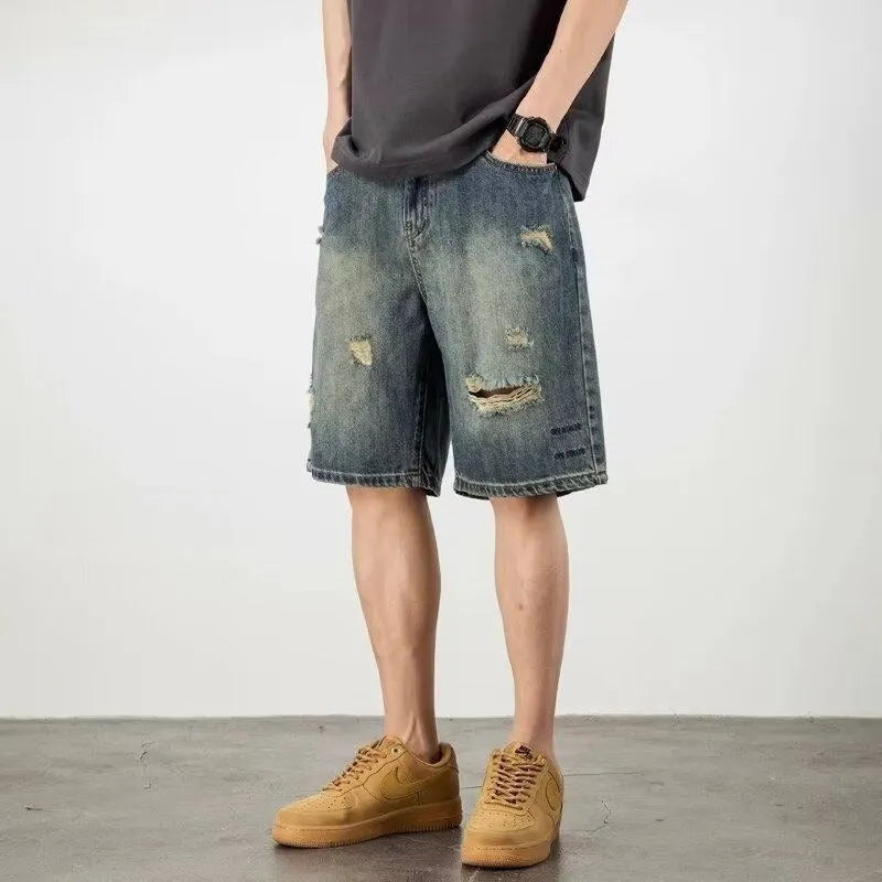 Men's blue denim shorts with loose hole retro styling and straight cut design