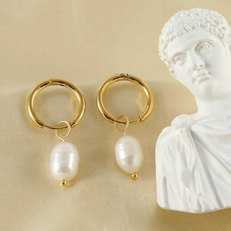 Gold geometric stainless steel earrings with pearl decorative elements