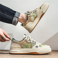 Men's beige and green canvas flat casual shoes with round toe on white background