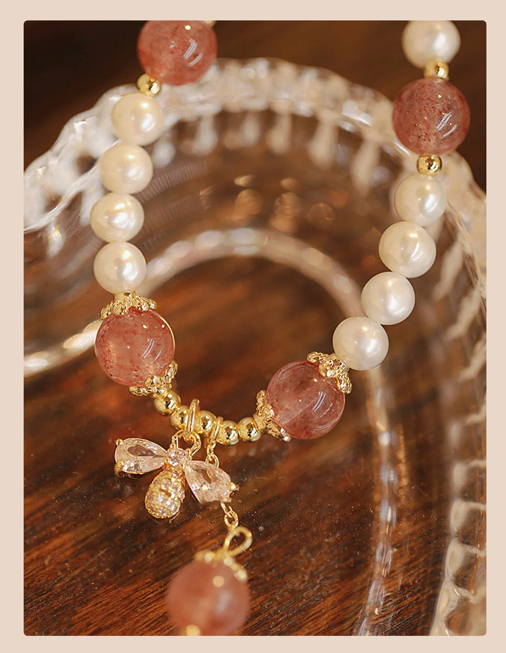 Crystal strawberry quartz bracelet with bow detail on white background, women's INS-style accessory
