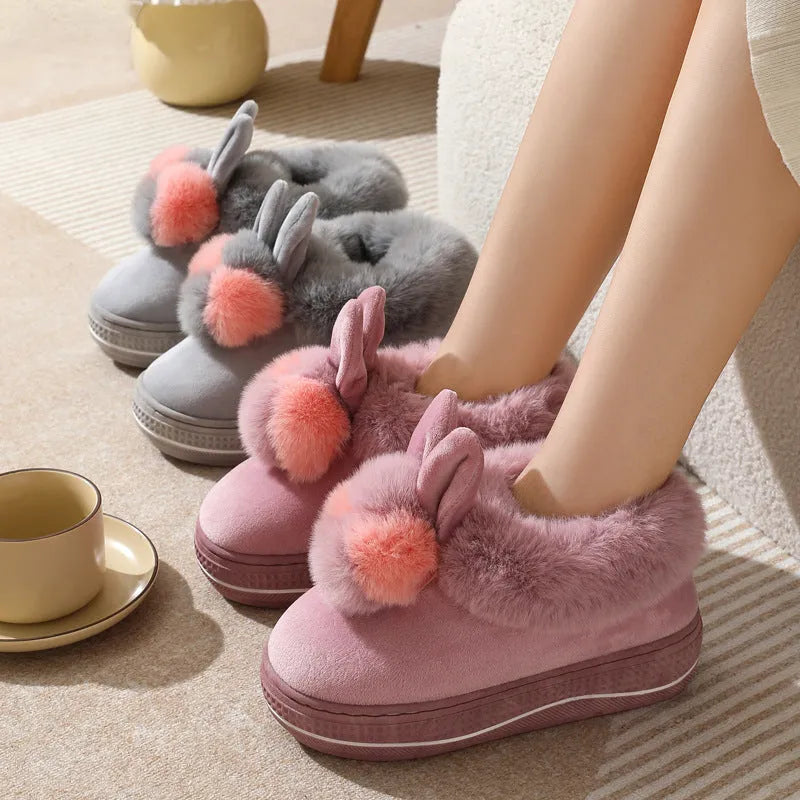 Winter high heel slippers with plush upper and thick TPR sole in gray colour on a floor