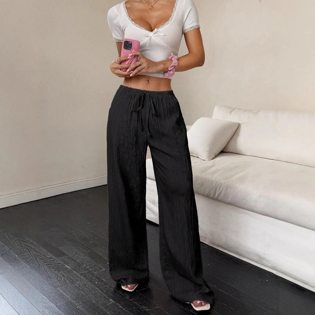 Women's black wide-leg trousers with lace-up waist detail on mid waist