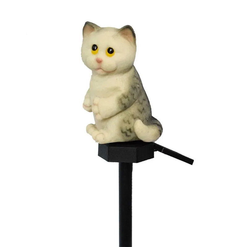 Brown cat-shaped solar-powered LED lawn light on grass