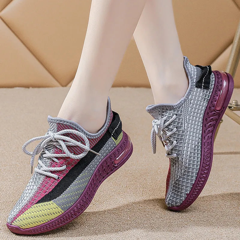 Women's lightweight breathable running shoes in purple, low-top lace-up design