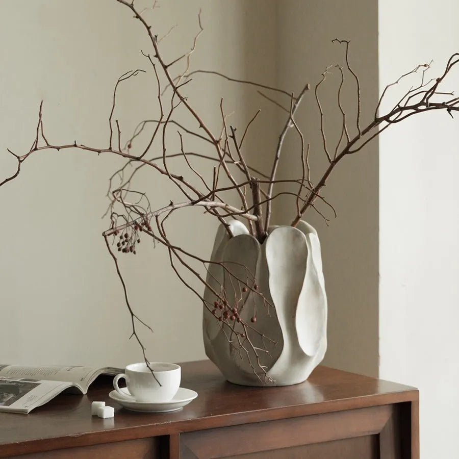 Handmade irregular ceramic vase in magnesium clay, shown in high and low style options.