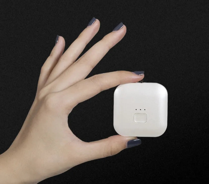 Mini USB portable air purifier necklace in blue colour, showing wearable design and single button.