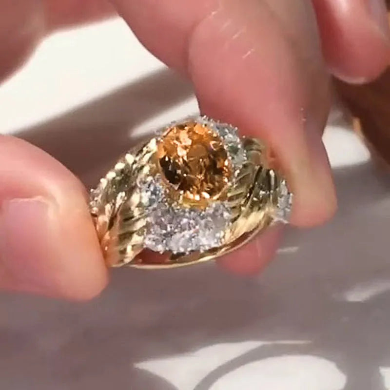 Gold copper feather ring with embossed design and yellow zircon stone in geometric setting