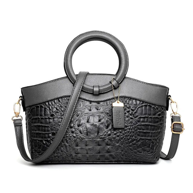 Women's fabric handbag with zippered compartments in multiple colour options showing dimensions