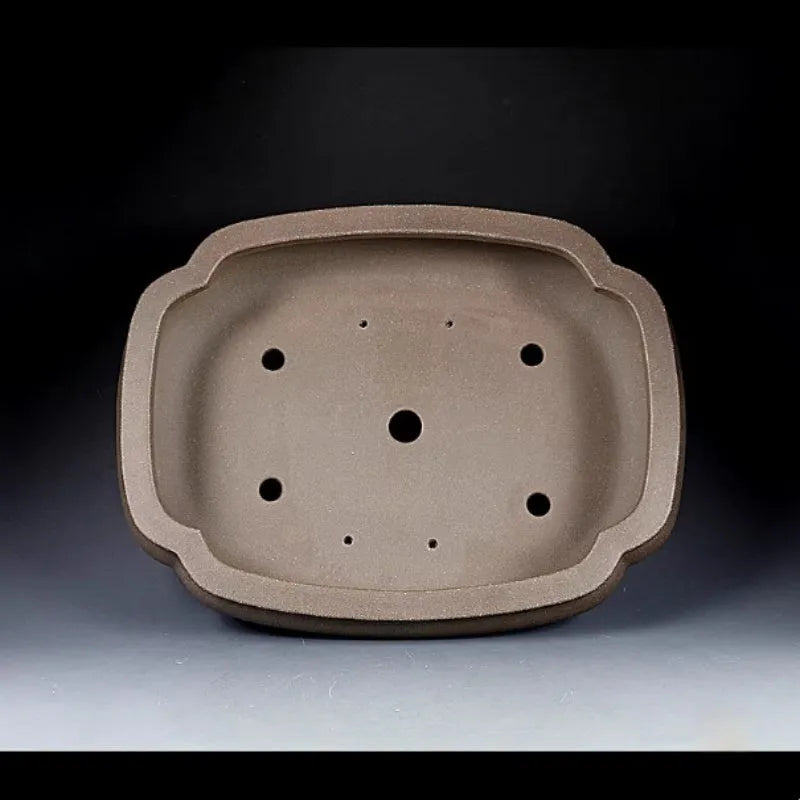 Handmade antique papaya-shaped purple clay flower pot for plants.