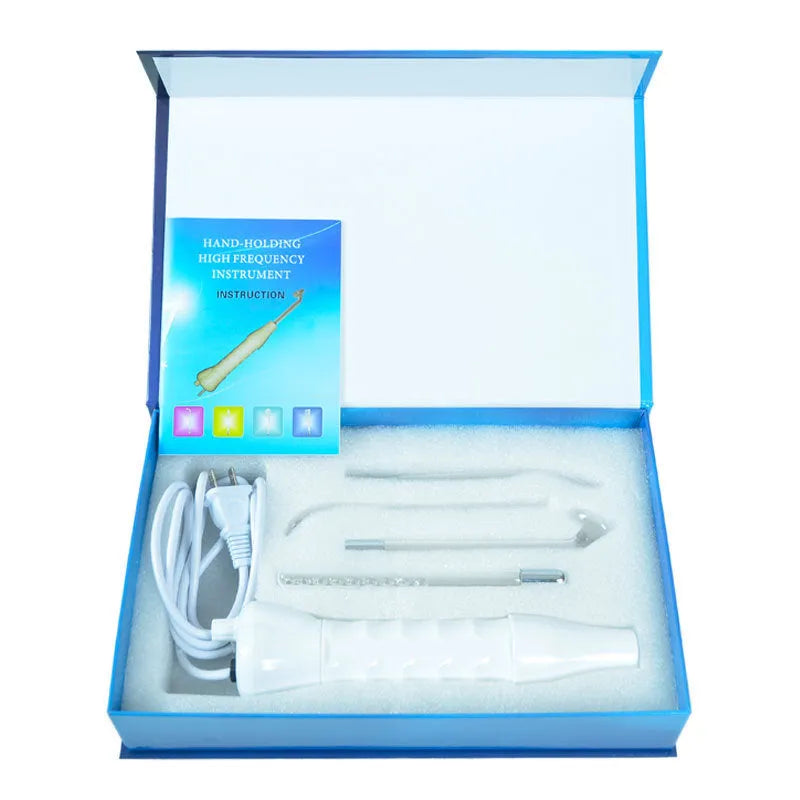 White high-frequency electrotherapy comb with four glass electrodes in packaging