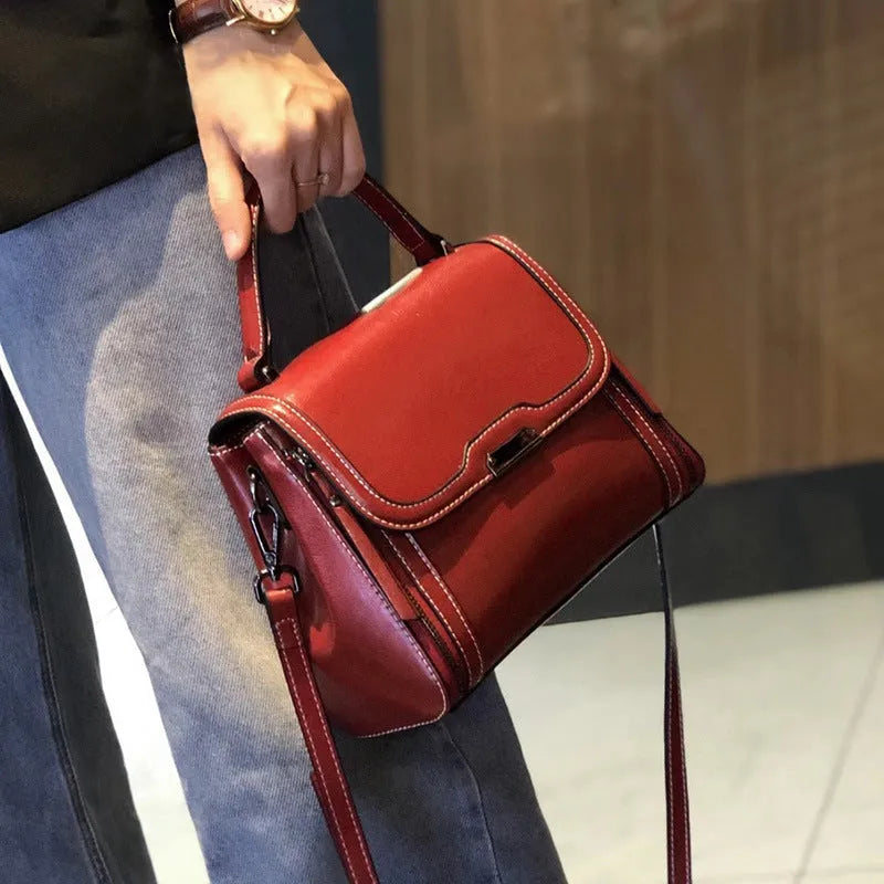 Women's genuine leather messenger bag in horizontal square shape with oil wax finish and multiple internal compartments