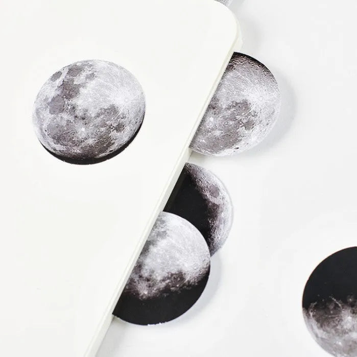 Box of 45 black moon phases and calendar planet stickers on self-adhesive paper