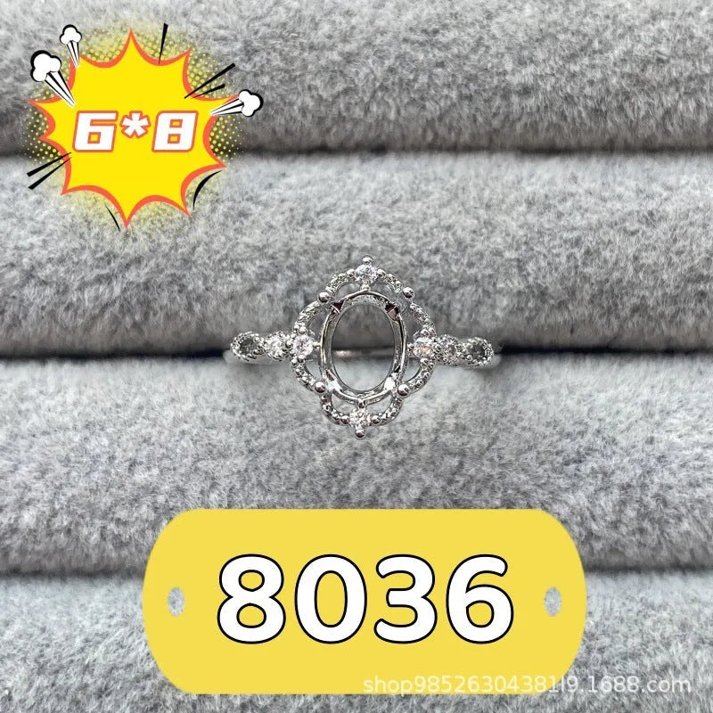 Oval denier copper ring with 6x8mm stone and star design on an open mouth band.