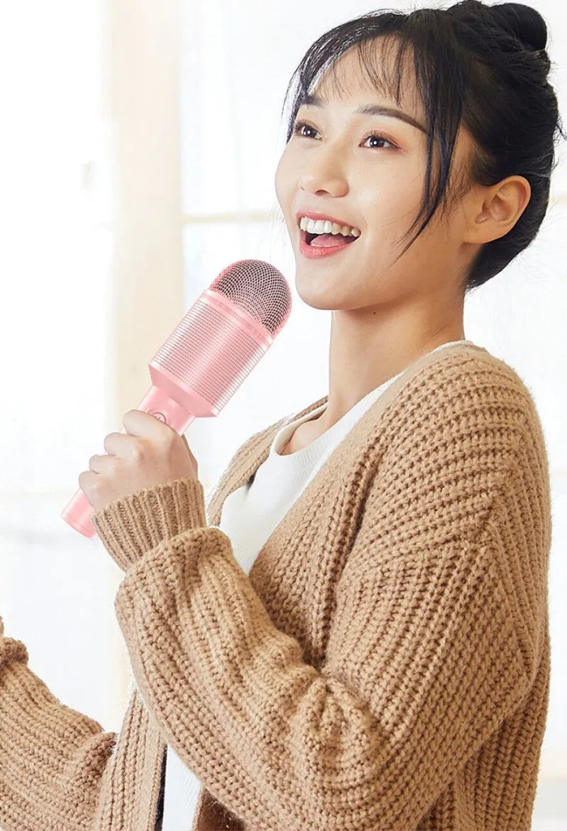 Wireless Bluetooth karaoke microphone in pink, blue, or green with USB connectivity