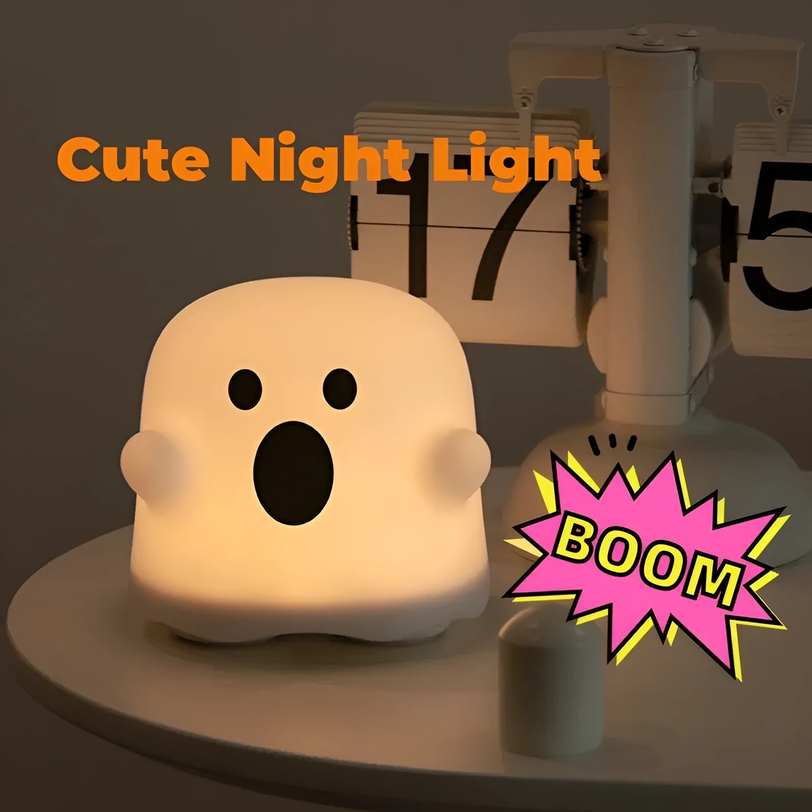 Silicone night light in Ah Ah style on a bedside table with soft glow
