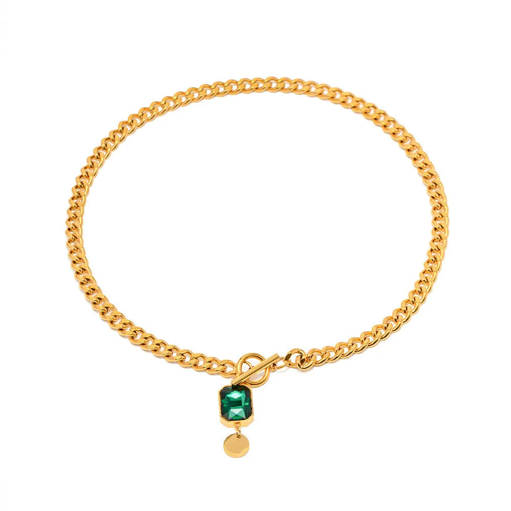 Gold-coloured geometric round zircon pendant necklace with a titanium steel Cuban link chain.