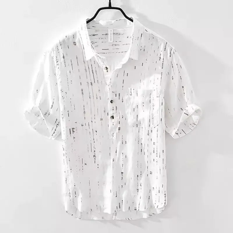 Men's loose fit short sleeve lapel polo shirt in black or white, shown on a hanger.