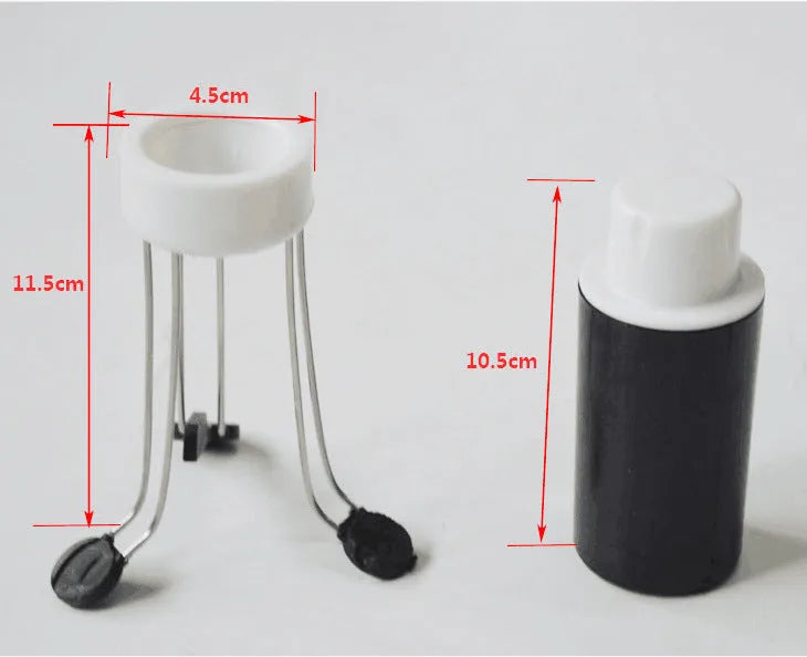 White and black wireless stir crazy mixer with stainless steel shaft on a kitchen countertop