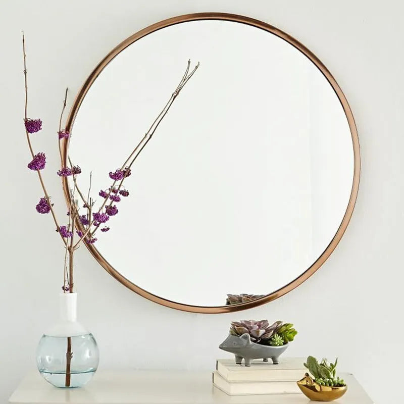 Round iron bathroom wall mirror in black finish, 30cm or 60cm diameter, hanging on a tiled wall for dressing and makeup use