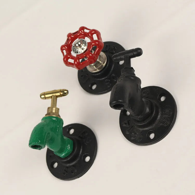 Water pipe style wall mounted towel hook in polished metal with industrial design