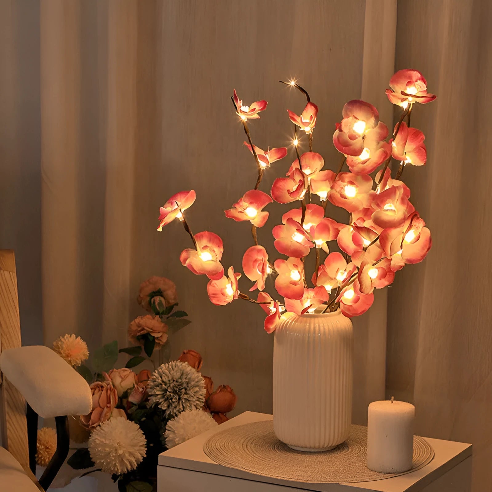 Pink Phalaenopsis branch shaped decorative LED light with 20 warm white lights, powered by batteries.