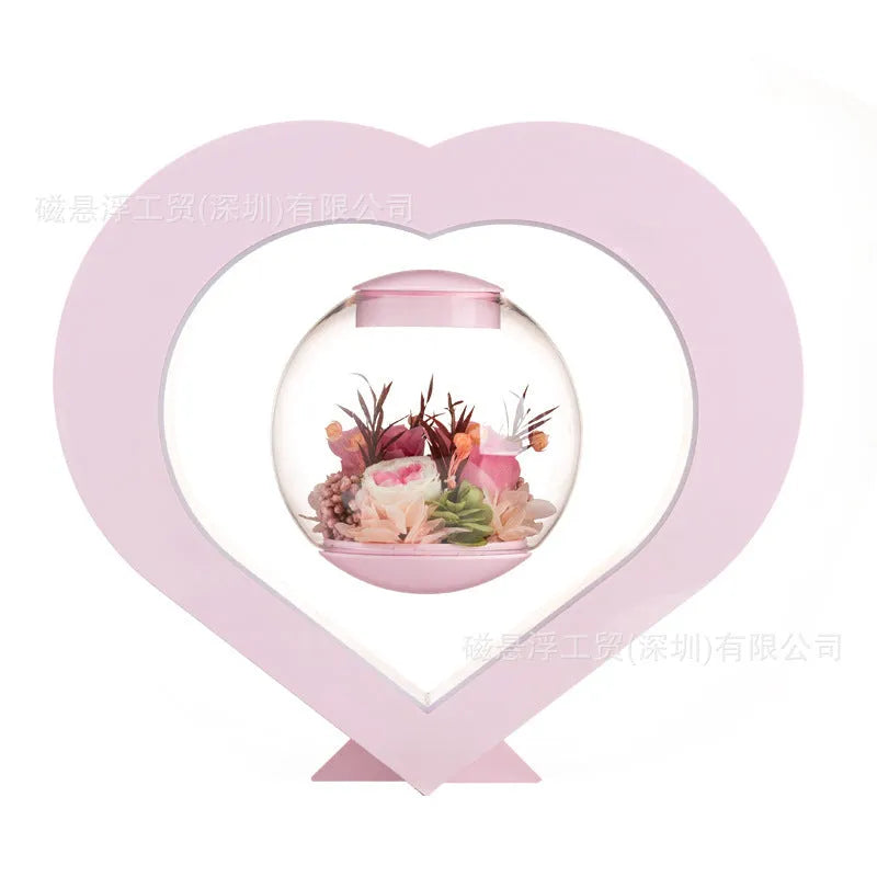 Pink preserved rose in ABS PC PVC ornament with Bluetooth base on tabletop