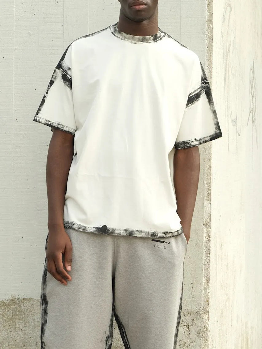 Casual white short sleeve top with printed draping design
