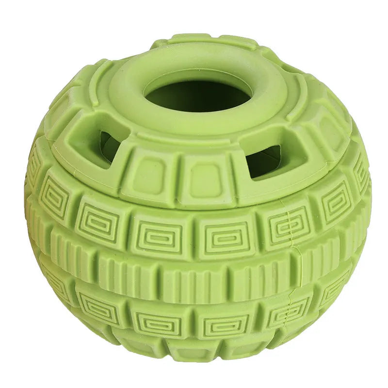 Natural rubber food dropping ball pet toy in green and orange, 14cm long, on light background