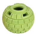Natural rubber food dropping ball pet toy in green and orange, 14cm long, on light background