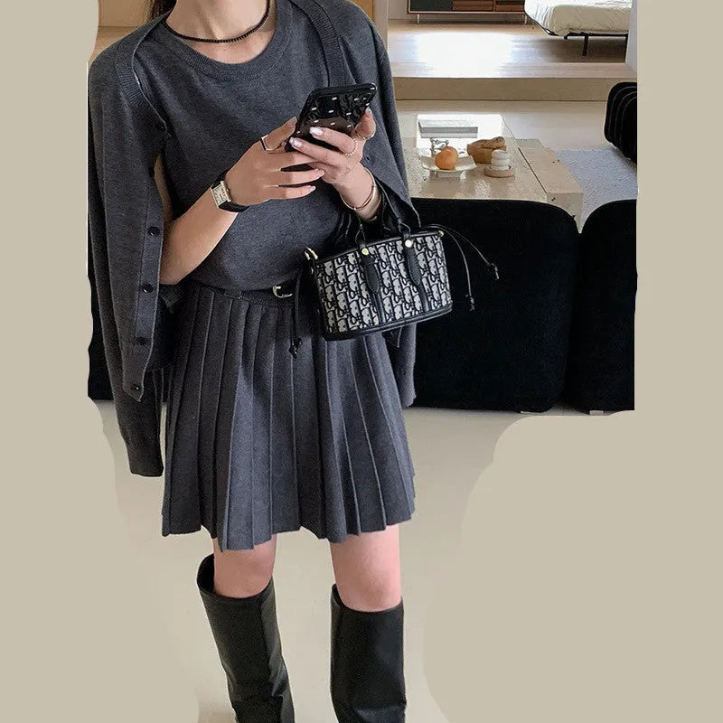 Grey and black women's knitted vest skirt and long-sleeved cardigan two-piece set with a belt.
