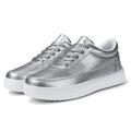 Women's white leather lace-up flat casual shoes shown from the side.