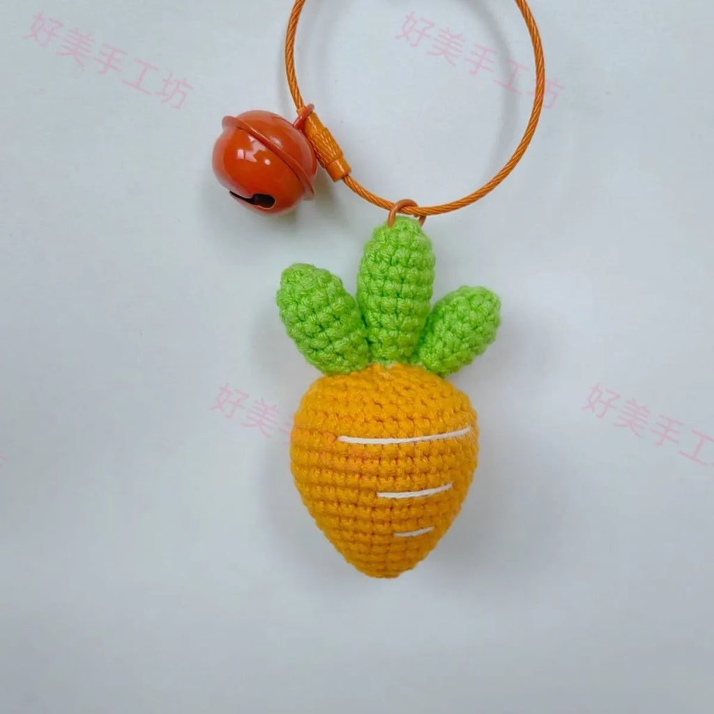 Orange and green carrot keychain pendant made from wool, shown on a key ring