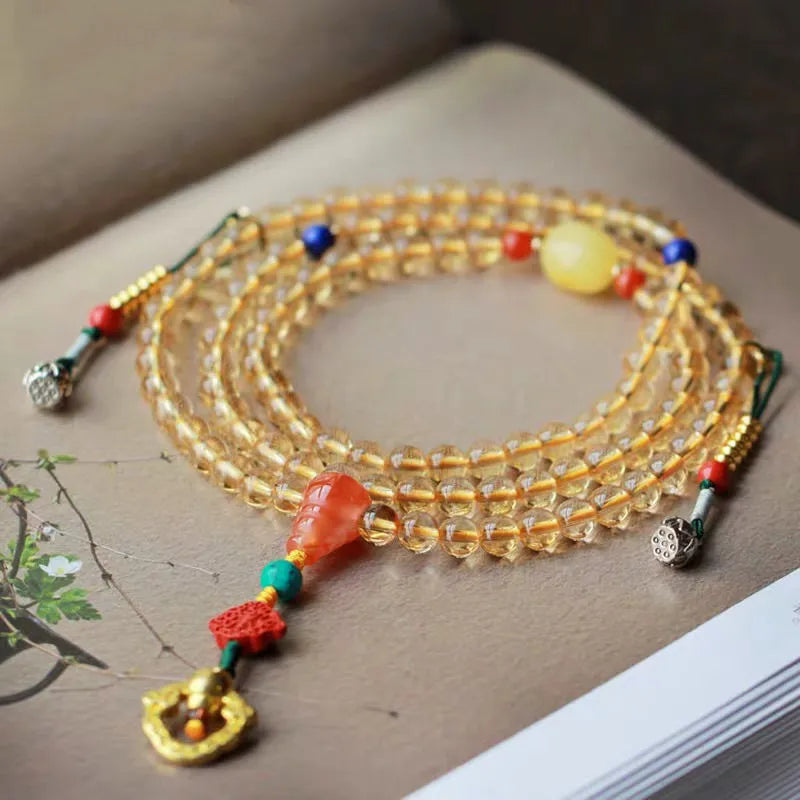 Natural citrine bracelet with red and yellow 1mm beads on filament string in light luxury style