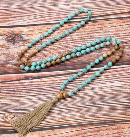 Alloy volcano white turquoise natural stone bracelet with adjustable cord on neutral background