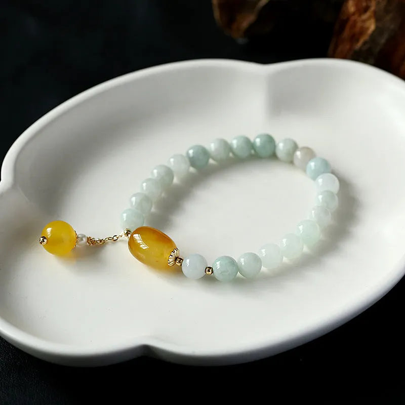 Women's bracelet with 7.5mm round agate beads and hanging tassel in 14K gilded finish