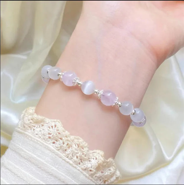 Cute handcrafted crystal bracelet in opal amethyst colour with moon-shaped pendant over 20mm size