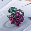 Black gold geometric flower ring with red simulation stones on gold-plated copper band