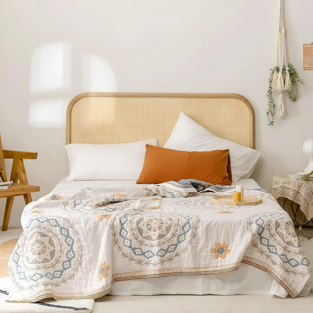 Cotton towel blanket with a geometric pattern, shown in two size options.