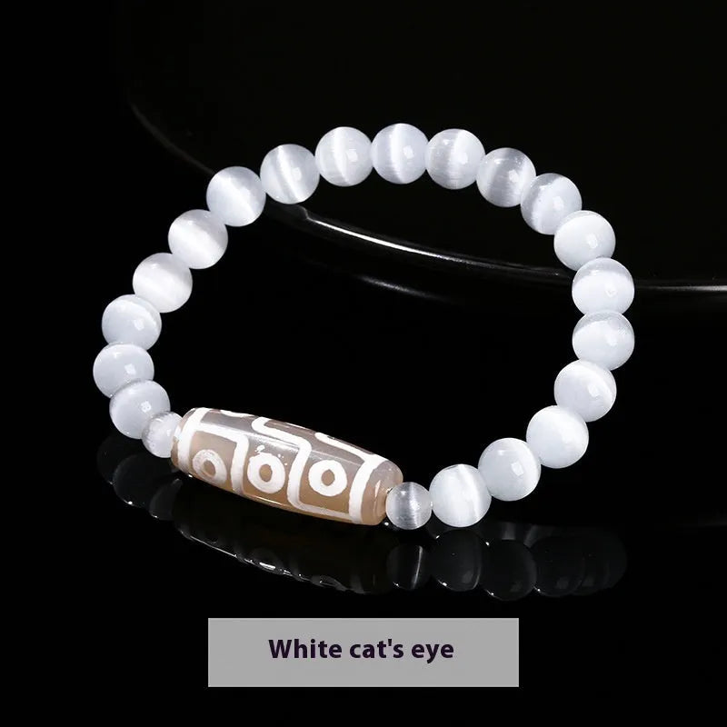 Handmade green dzi bead barrel shaped bracelet with 8mm natural agate beads on white background