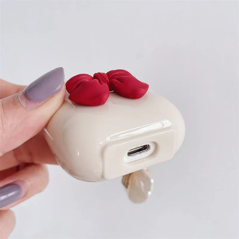 Beige red bow shell TPU case for AirPods Pro wireless earphones with clamshell design
