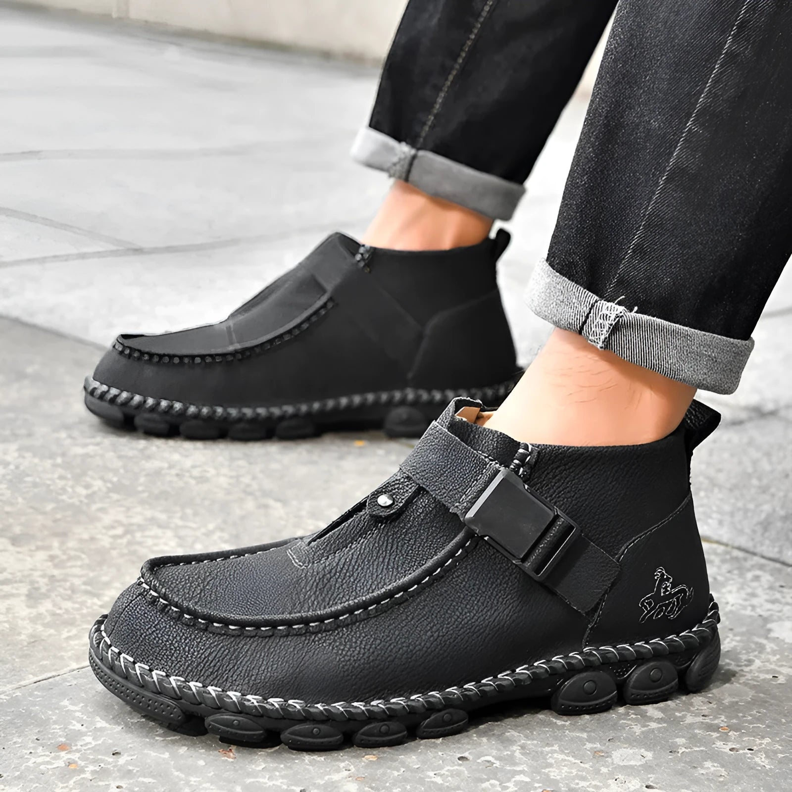 Handmade brown men's casual slip-on shoes with flat heel and sewn sole.