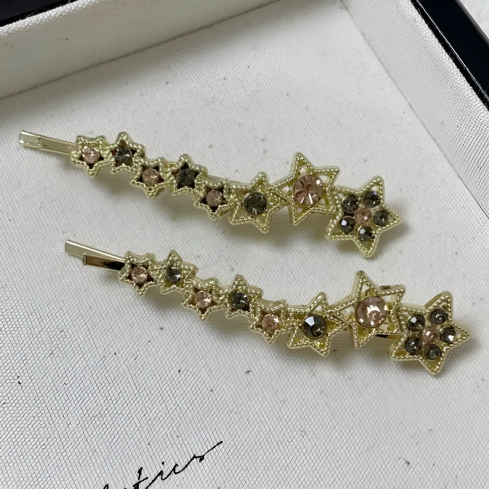 Gold electroplated alloy barrette clip with five-pointed star rhinestone design for bangs and hair sections