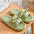 Cute deer horn design EVA flip flop slippers for women and men in light yellow, shown on a non-slip sole.