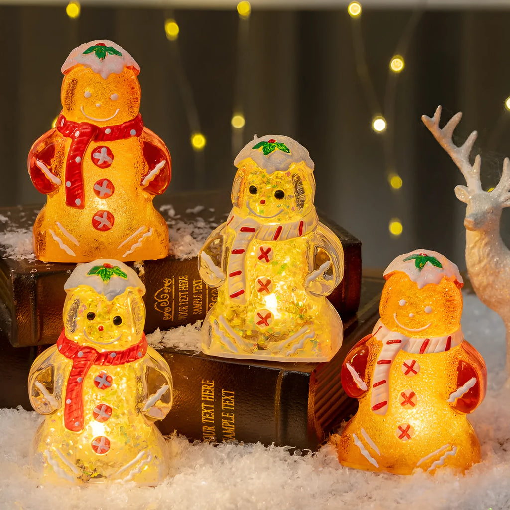 Glowing LED gingerbread man snowman Christmas ornament with a red scarf, measuring 6.5cm by 4cm by 10.5cm.