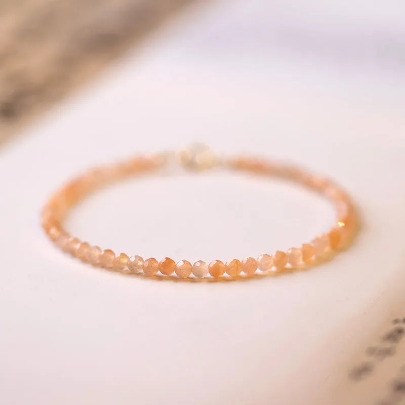 Natural sunstone crystal bracelet with ultra-thin 3mm beads on wrist, handmade women's accessory