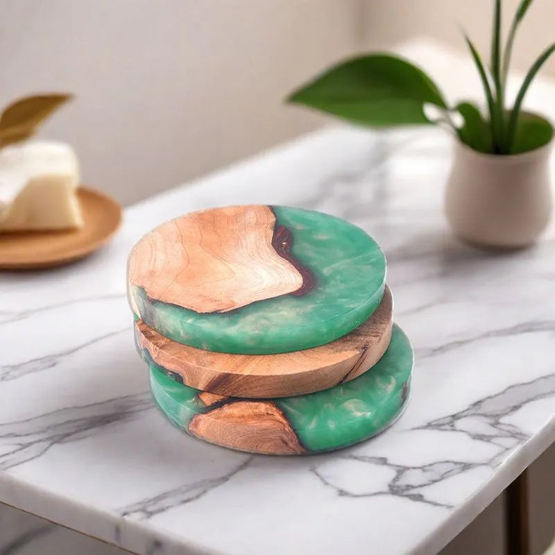 Round and square wooden resin coasters in green and black for heat insulation.