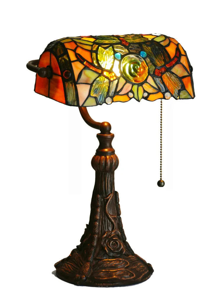 Tiffany stained glass table lamp with coloured glass shade on resin base for desk lighting