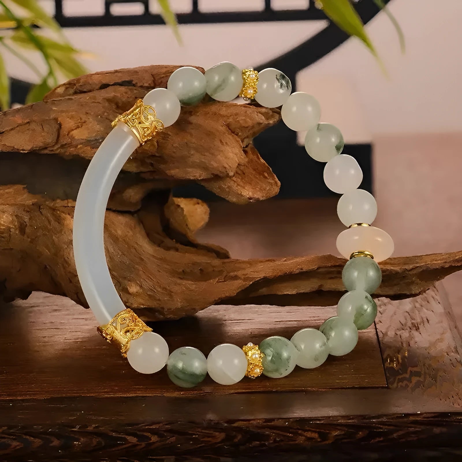 Emerald green Tian Shan Cui half bracelet with floating flower girl design and round motif on light background